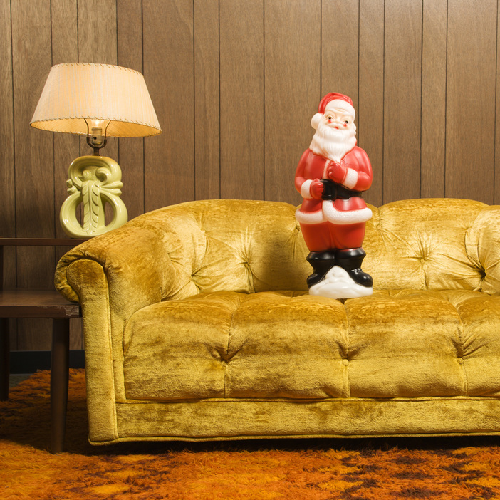 Santa cluse figurine on a sofa